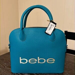 Teal colored bebe purse. Never worn.